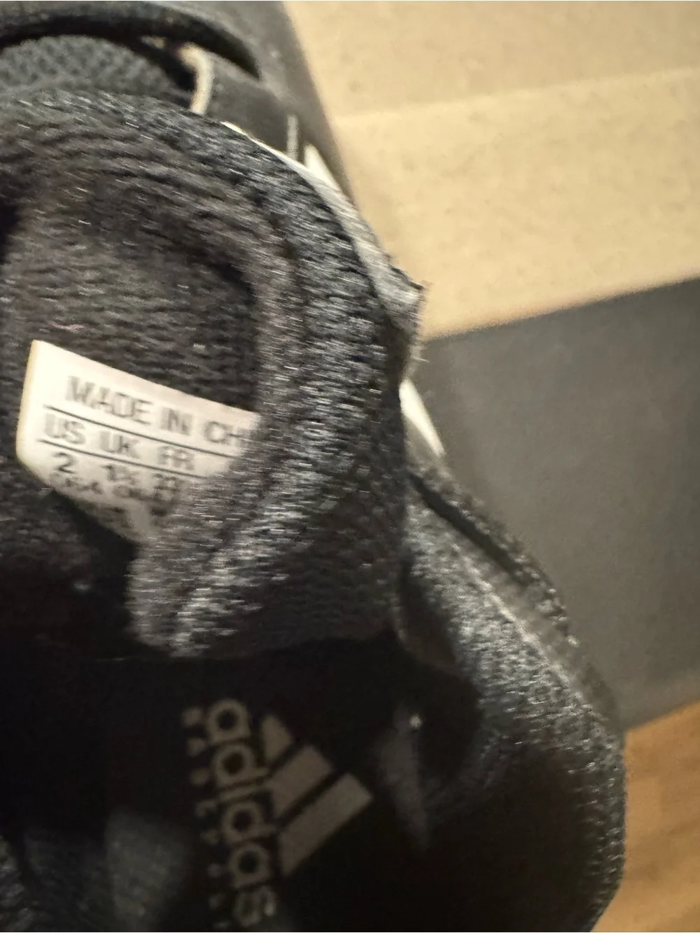adidas boys  Black Athletic Cleats with White Stripes size 2